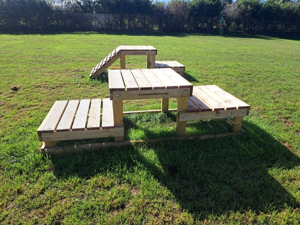 Wooden step platforms for dogs to climb at Foxholes Farm Dog Park