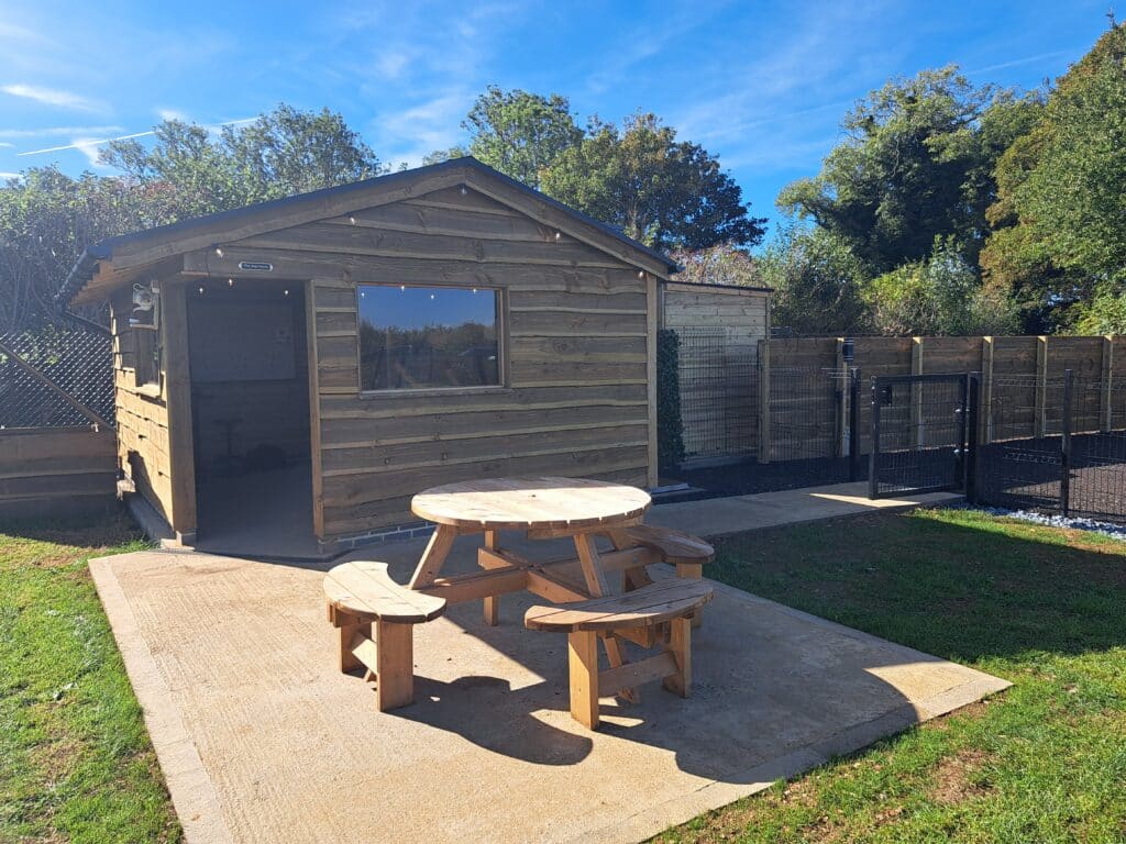 Outside the wooden cabin at Foxholes Farm Dog Park