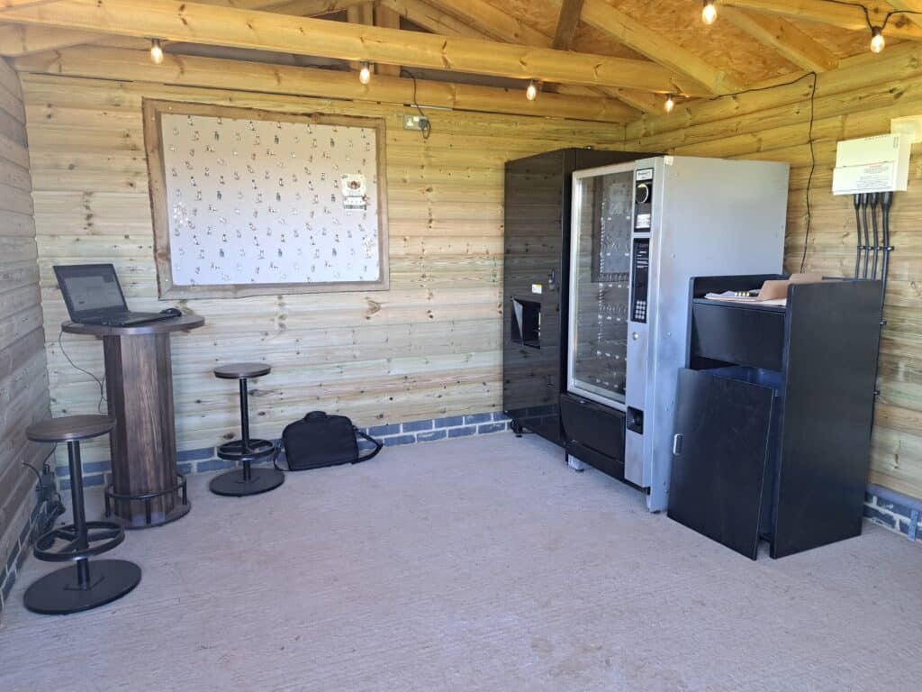 Inside the Foxholes Farm cabin with coffee and snack vending machines